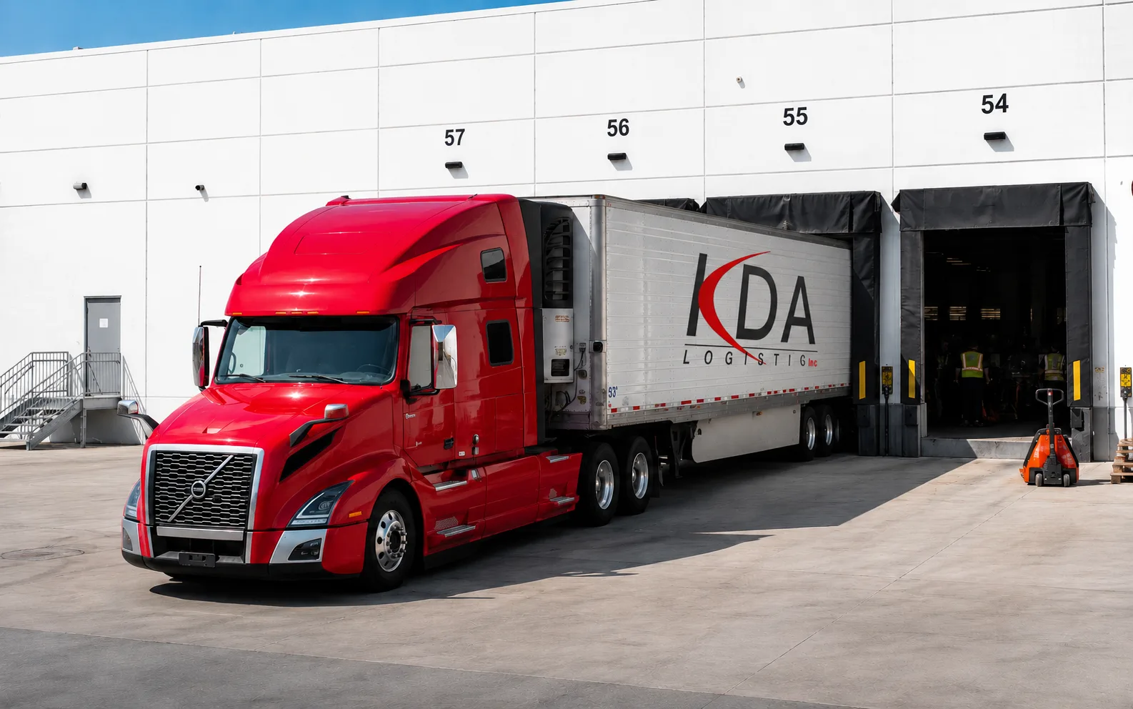Refrigerated trailer backed up to a distribution warehouse dock